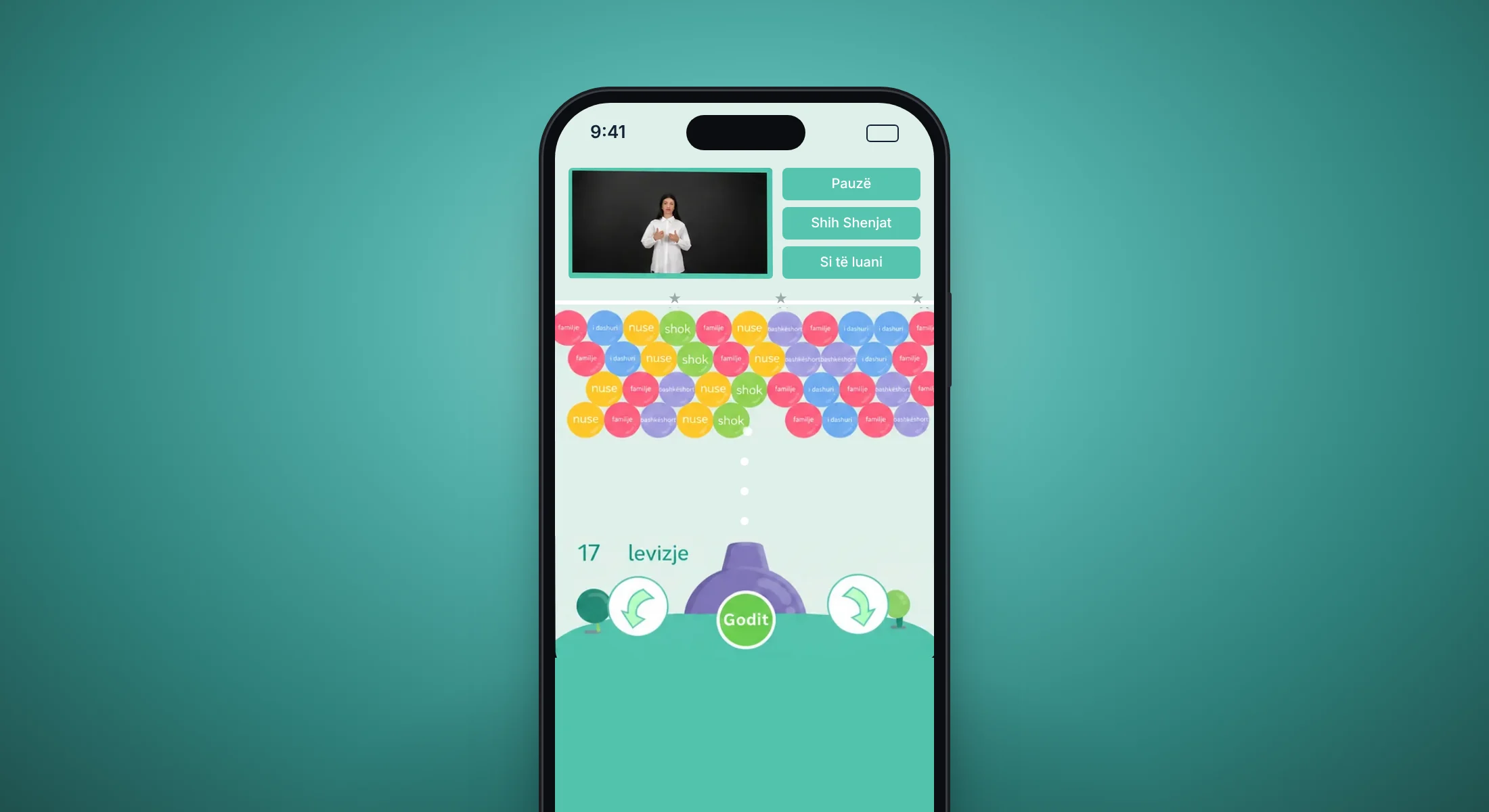 The PopSign game on a phone, a sign video above the bubbles